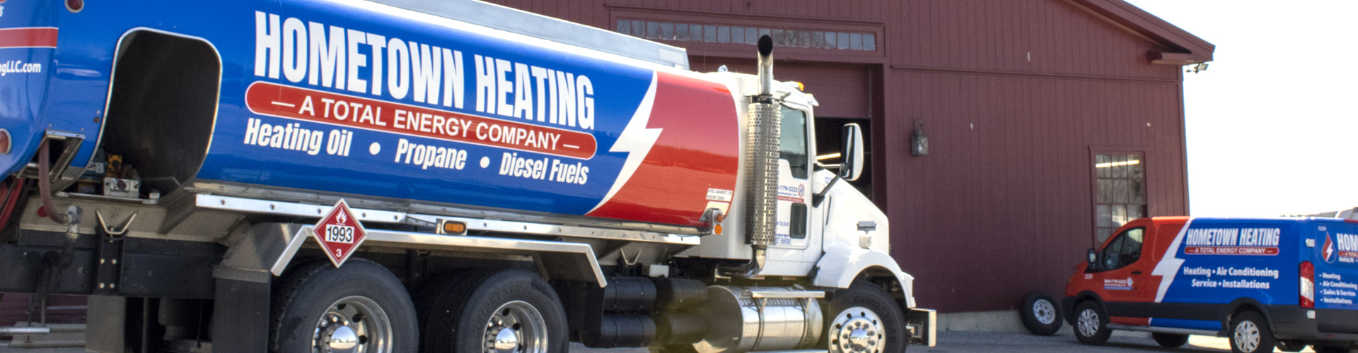 Hometown Heating oil truck and service van in front of the company's headquarters in Brooklyn, CT