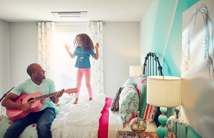 A family enjoys air clean of allergens, dust and bacteria with their Mitsubishi Mini-Split AC unit